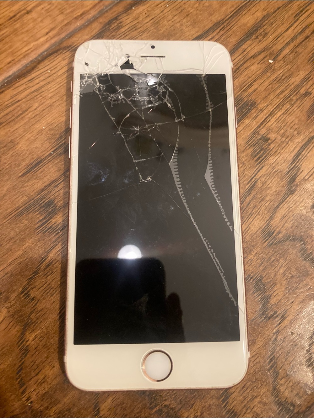 Apple iPhone with White Front and Rose Gold Trim - Cracked Screen